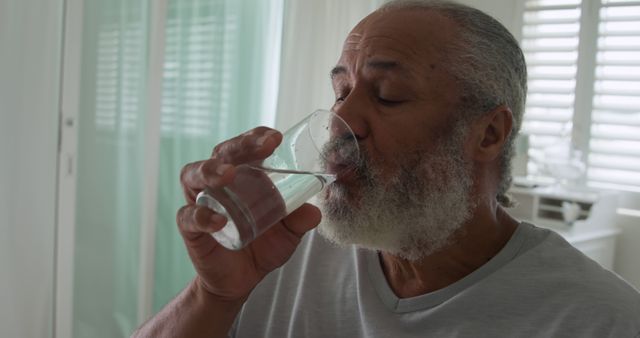 Elderly Man Drinking Water for Hydration at Home - Download Free Stock Images Pikwizard.com