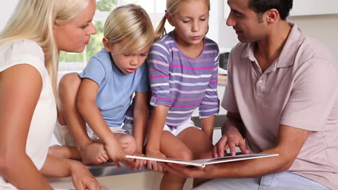 Family Bonding Over Storytime in Kitchen Setting