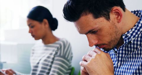 Thoughtful Man Waiting in Hospital Corridor