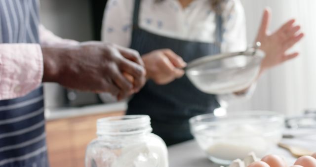 Diverse couple baking together in modern kitchen - Download Free Stock Images Pikwizard.com