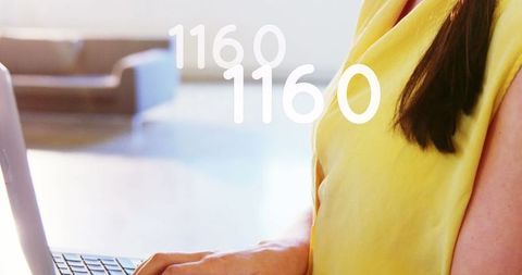 Woman Using Laptop with Floating Growing Numbers