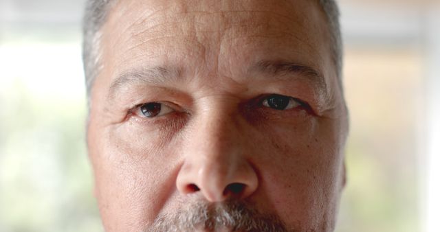 Close-Up of Elderly Man with Serious Expression in Natural Light - Download Free Stock Images Pikwizard.com