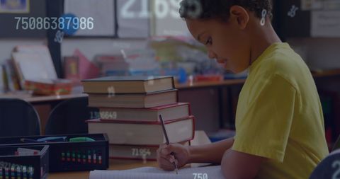 Focused Schoolboy Writing Surrounded by Floating Numbers