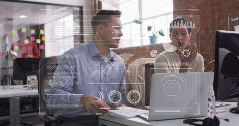 Coworkers Collaborating Over Augmented Reality Dashboard, Guiding Business Strategy