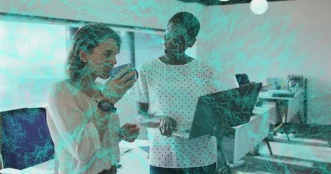 Professional Women Collaborating in Open-Plan Office