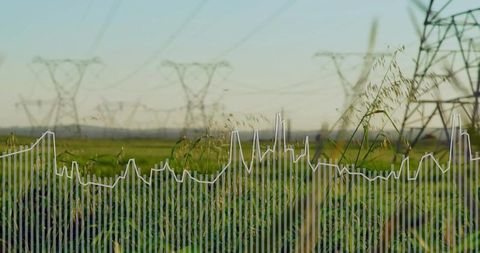 Green meadow with high-voltage pylons and data overlay showing energy trend chart