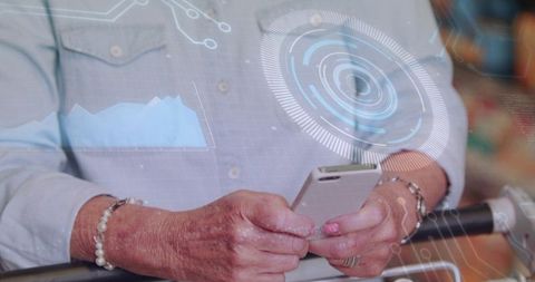 Senior woman using smartphone with augmented reality HUD while shopping in retail