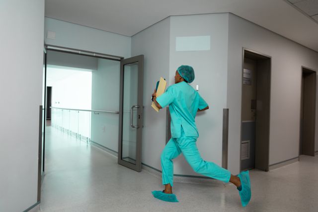 African American Female Doctor Running in Hospital Corridor - Download Free Stock Images Pikwizard.com