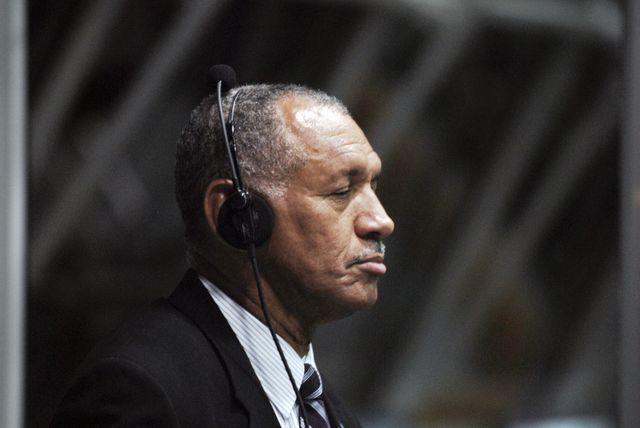 Charles Bolden, NASA Administrator, positioned in NASA Kennedy Space Center's Firing Room 4, awaits the launch of space shuttle Discovery on the STS-128 mission. The photo represents leadership, anticipation, and space exploration, capturing a key moment during the mission's preparations. Useful for stories on space missions, NASA leadership, and historic spaceflight events.