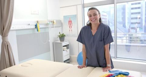 Smiling Female Physiotherapist in Modern Clinic - Download Free Stock Images Pikwizard.com