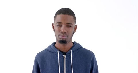 Thoughtful Young Man in Blue Hoodie Against White Background - Download Free Stock Images Pikwizard.com