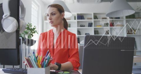 Businesswoman Analyzing Graphs in Modern Office - Download Free Stock Images Pikwizard.com
