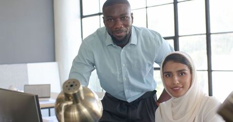 Business Colleagues Collaborating in Contemporary Office