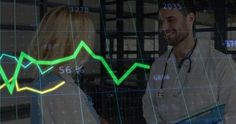 Medical Professionals Analyzing Graphs in Hospital Corridor
