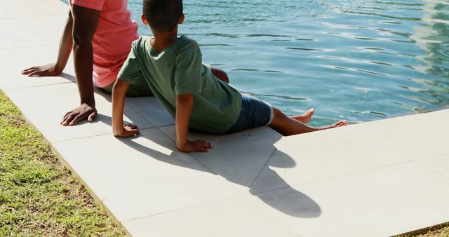 Father and Son Relaxing by the Pool on a Sunny Day - Download Free Stock Images Pikwizard.com