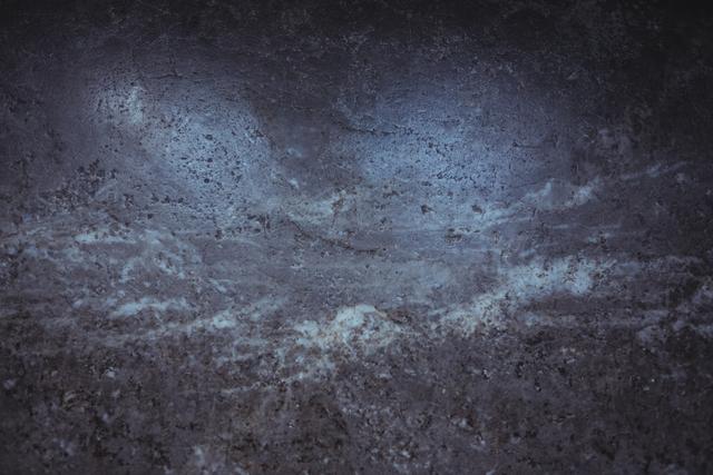 This image shows a close-up of an old wall with peeled plaster, creating a grunge texture. The weathered and aged appearance makes it ideal for use in backgrounds, design projects, or as a texture overlay in graphic design. It can be used to convey themes of decay, rustic charm, or vintage aesthetics.