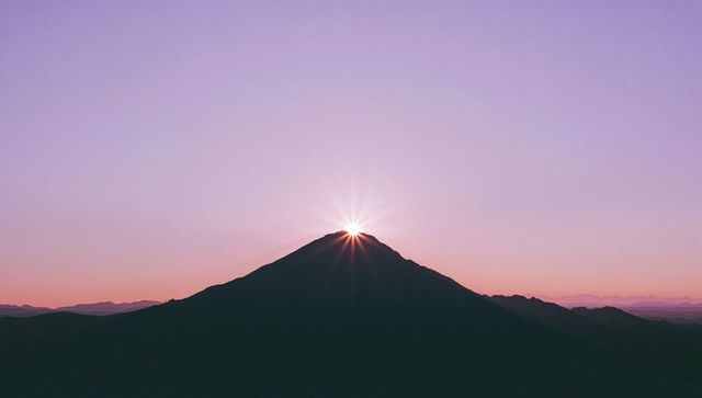 Sunburst at Mountain Peak with Pastel Dawn Gradient