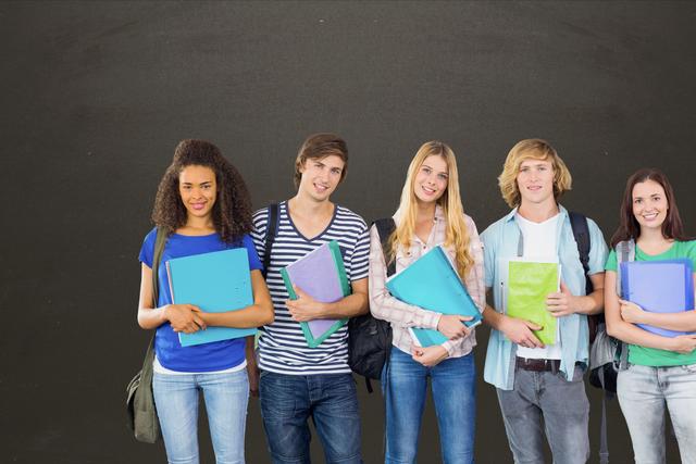 Digital composite of Students smiling against chalkboard