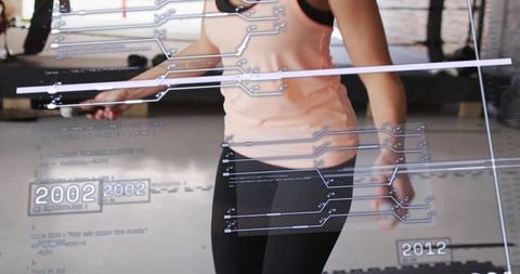 Female athlete jumping rope with futuristic hud fitness data overlay in gym studio