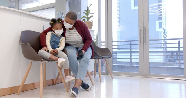 Mother Comforting Sad Daughter in Medical Clinic Waiting Room - Download Free Stock Images Pikwizard.com