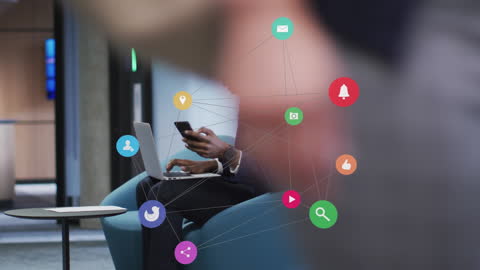 Connected Icons and Businessman Using Cellphone and Laptop