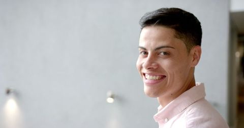 Joyful Man in Casual Pink Shirt Smiling with Confidence - Download Free Stock Images Pikwizard.com