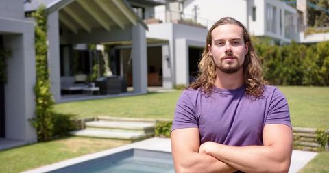 Relaxed Young Man Standing in Backyard with Pool - Download Free Stock Images Pikwizard.com