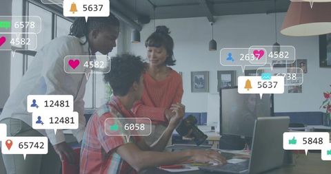 Marketing team collaborating with dslr camera and floating social media notifications in office