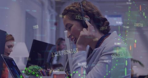 Businesswoman Using Computer with Digital Financial Interface