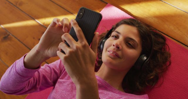 Smiling Woman Relaxing with Headphones and Smartphone - Download Free Stock Images Pikwizard.com