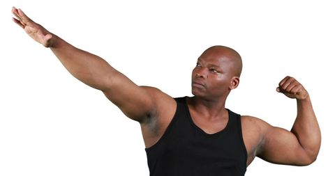 Confident African American Man Striking Strongman Pose - Download Free Stock Images Pikwizard.com