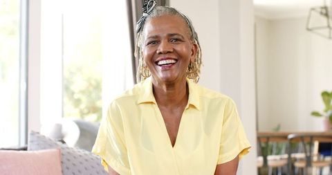Smiling African American Senior Woman in Bright Home Interior