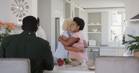African American Friends Enjoying Time Taagethew/in Modern Kitchen