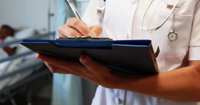 Nurse Writing Patient Notes in Hospital Ward - Download Free Stock Images Pikwizard.com