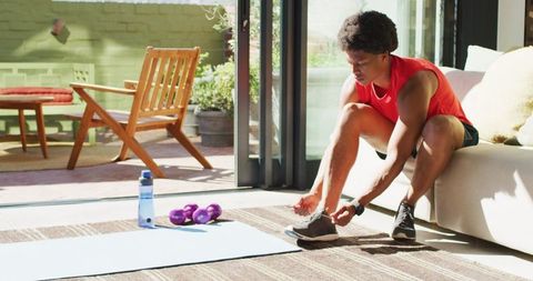 African American Man Preparing for Home Workout with Equipment - Download Free Stock Images Pikwizard.com