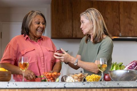 Senior Friends Preparing Meal, Embracing Healthy Lifestyle in Modern Kitchen