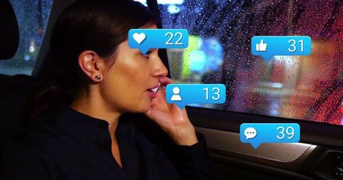 Woman Engaged in Social Media on Night Drive