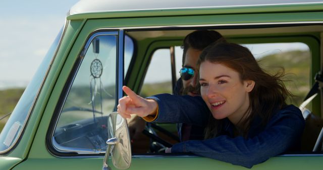 Young Woman Pointing Out View from Passenger Seat in a Vintage Car - Download Free Stock Images Pikwizard.com