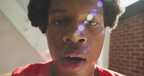 Vibrant Urban Portrait with Lens Flare in Loft Setting