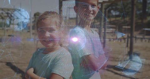 Siblings standing back-to-back in park in teal shirts with futuristic holographic overlay