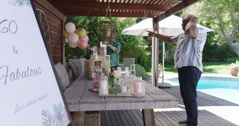 Garden Party Setup with Balloons and Candles for Senior Birthday Celebration