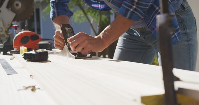 Carpenter Sanding Wooden Plank Outdoors for Home Renovation Project - Download Free Stock Images Pikwizard.com