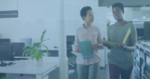 Business Professionals Discussing Overlapping Stock Market Data in Office Setting