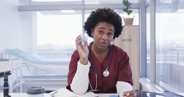 Confident Female Doctor Explaining Medical Device in Modern Clinic - Download Free Stock Images Pikwizard.com