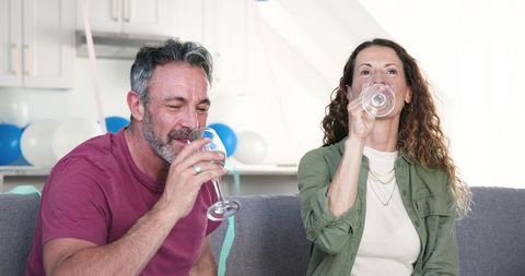 Couple Enjoying Drinks at Celebration Event