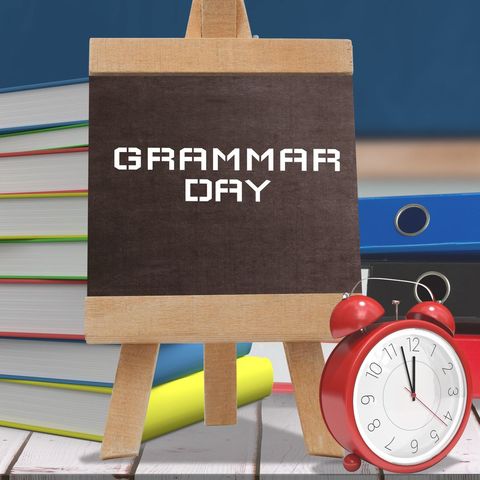 grammar day celebration with books and alarm clock - Download Free Stock Templates Pikwizard.com