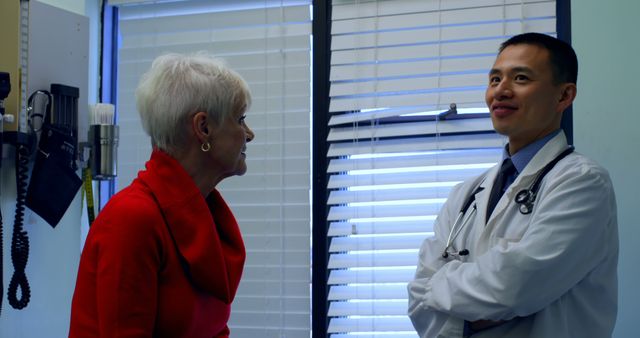 Elderly Patient Discussing Health Concerns with Doctor in Medical Office - Download Free Stock Images Pikwizard.com