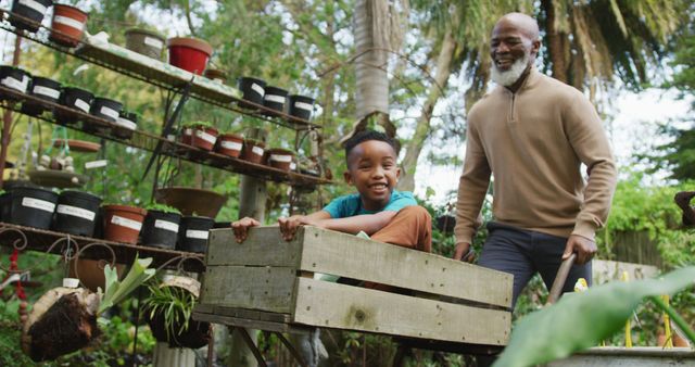 Happy Grandfather and Grandson Gardening Together in Lush Garden - Download Free Stock Images Pikwizard.com