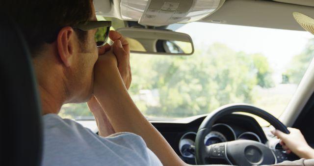 Man sneezing while driving car - Download Free Stock Images Pikwizard.com