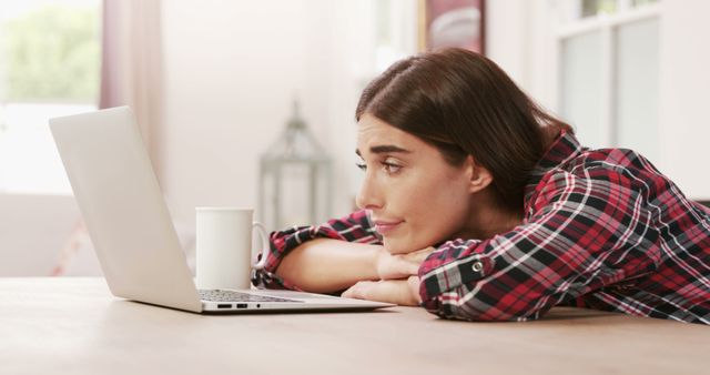 Tired Woman Working from Home with Laptop and Coffee Mug - Download Free Stock Images Pikwizard.com